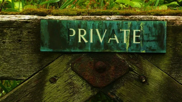 Private sign on a wooden gateway